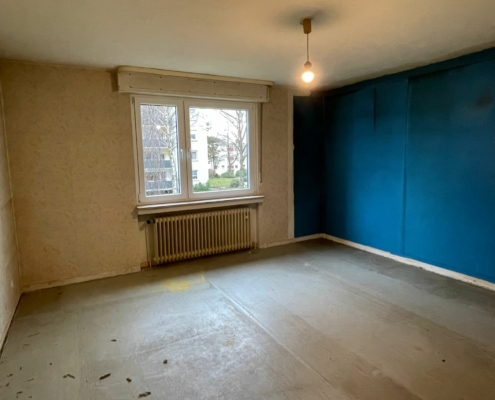 Schlafzimmer der Wohnung im unrenovierten Zustand - Martina Wagner Immobilien